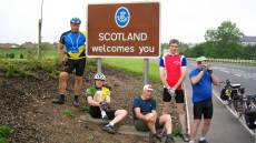 Group pose at the Scottish Border Sign.